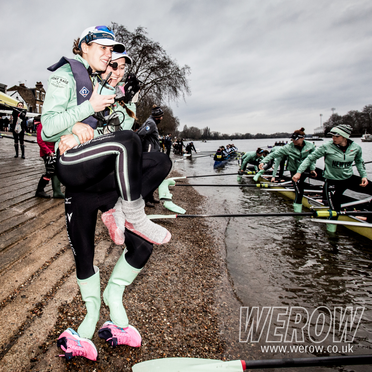 Thea Zabell of CUWBC carries Sophie Shapter to her boat before WEHoRR