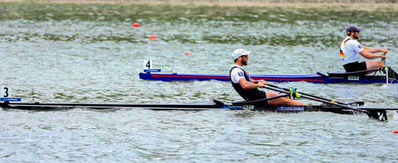Robbie Manson of New Zealand crossing the line at World Rowing Cup II in Linz to take the gold medal